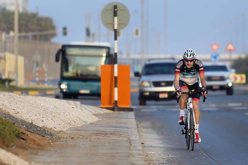 ABU DHABI, UNITED ARAB EMIRATES - - -  December 21, 2015 --- Kevin Duell, a cyclist, peddles along a road in front of the Al Raha Hotel on Monday, December 21, 2015, in Abu Dhabi. Duell is quoted in a story about how it is safer to cycle in Abu Dhabi than the UK.   ( DELORES JOHNSON / The National )  
ID: 17138
Reporter: Anam Rizvi
Section: NA *** Local Caption ***  DJ-211215-NA-Cycle-17138-009.jpg