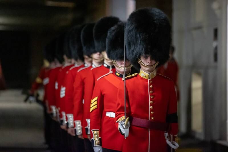 Members of the of the Grenadier Guards form up at Wellington Barracks ahead of a final full dress rehearsal. EPA