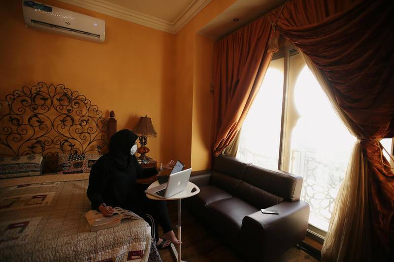 Iqra Anser, a medical student, attends her online lectures during her 14-day-long self quarantine after returning from Georgia, following the outbreak of the coronavirus disease (COVID-19), in Manama, Bahrain. Reuters