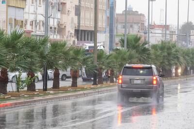 A vehicle travels through rain in Umluj, a governorate in Saudi Arabia's Tabuk region, in April. More rains have been forecast in the area this week. SPA