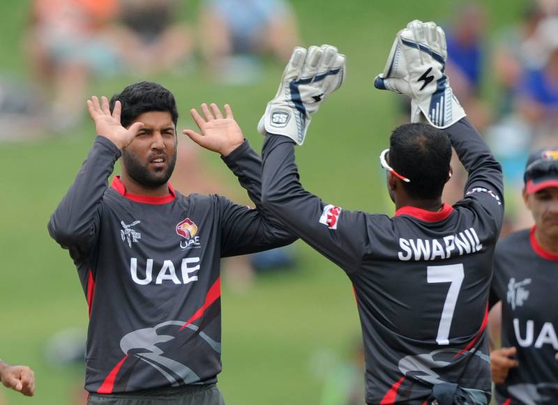 UAE bowler Mohammed Naveed, left, celebrates taking a wicket at last month's 2015 Cricket World Cup in New Zealand with wicketkeeper Swapnil Patil. Ross Setford / AP / March 4, 2015
