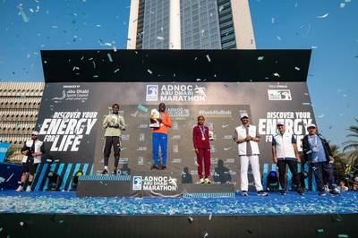 Dr Sultan al Jaber, Minister of Industry and Advanced Technology and Adnoc's group chief executive, honours Kenyan-born Bahraini athlete Eunice Chumba and winners of the Adnoc Abu Dhabi Marathon on Saturday. Wam