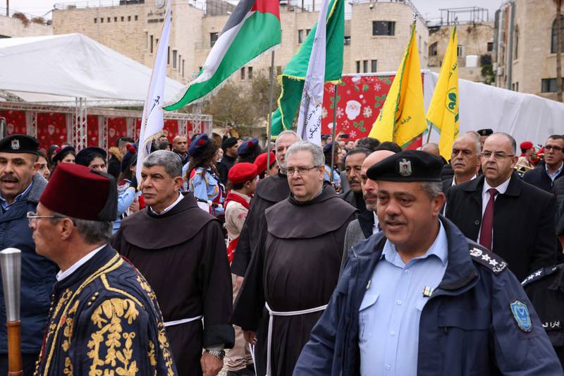 Custodian of the Holy Land Father Francesco Patton, centre, arrives for the ceremony. AFP