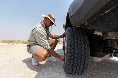 Getting a puncture out in the desert is part and parcel of the job, Mr Du Plooy says