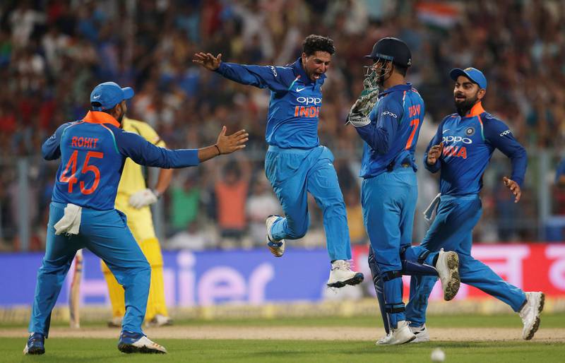 Cricket - India v Australia - Second One Day International Match - Kolkata, India – September 21, 2017 – India's Kuldeep Yadav (2-L) celebrates with his team mates after dismissing Australia's Pat Cummins. REUTERS/Adnan Abidi
