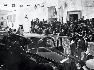 Sheikh Zayed waves to crowds from the same Rolls-Royce. Courtesy: National Archives