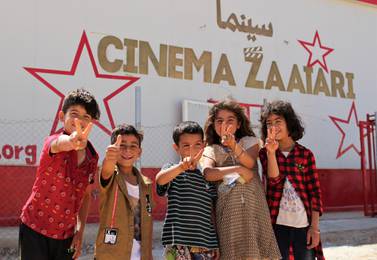 Syrian refugee children outside the newly opened movie theatre. Courtesy Unicef