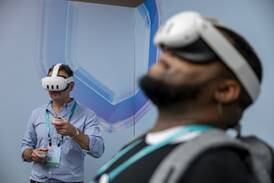 Attendees try Meta's latest Quest 3 mixed-reality headsets during the Meta Connect event in Menlo Park, California, on Wednesday. Bloomberg