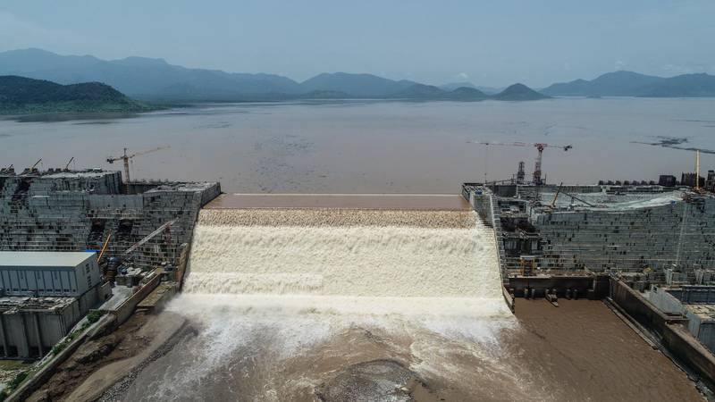 This handout picture taken on July 20, 2020, and released by Adwa Pictures on July 27, 2020, shows an aerial view Grand Ethiopian Renaissance Dam on the Blue Nile River in Guba, northwest Ethiopia. - Ethiopia said on July 21 it had hit its first-year target for filling the Grand Ethiopian Renaissance Dam, a concrete colossus 145 metres (475 feet) high that has stoked tensions with downstream neighbours Egypt and Sudan. (Photo by - / Adwa Pictures / AFP) / RESTRICTED TO EDITORIAL USE - MANDATORY CREDIT "AFP PHOTO / ADWA PICTURES " - NO MARKETING NO ADVERTISING CAMPAIGNS - DISTRIBUTED AS A SERVICE TO CLIENTS / “The erroneous mention[s] appearing in the metadata of this photo by Yirga MENGISTU has been modified in AFP systems in the following manner: [ - ] instead of [Yirga Mengitsu]. Please immediately remove the erroneous mention[s] from all your online services and delete it (them) from your servers. If you have been authorized by AFP to distribute it (them) to third parties, please ensure that the same actions are carried out by them. Failure to promptly comply with these instructions will entail liability on your part for any continued or post notification usage. Therefore we thank you very much for all your attention and prompt action. We are sorry for the inconvenience this notification may cause and remain at your disposal for any further information you may require.”