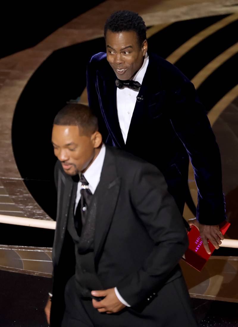 Actor Will Smith leaves the stage at the Oscars after slapping comedian Chris Rock for a remark he made about Jada Pinkett Smith. The actor's wife lost her hair because of alopecia. AP