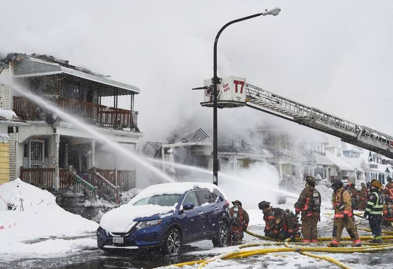 Firefighters battle a house fire in Buffalo, New York.  EPA 