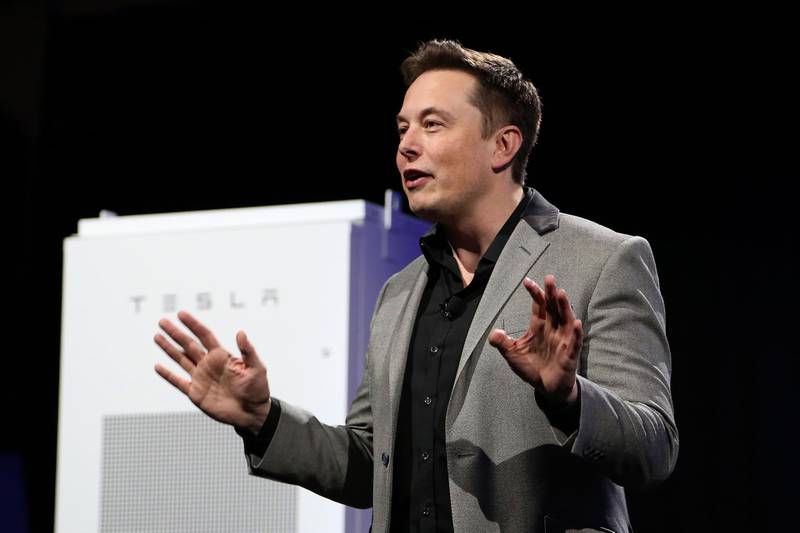 (FILES) A file photo taken on April 30, 2015, shows Tesla Motors CEO Elon Musk unveiling large utility scale home batteries at the Tesla Design Studio in Hawthorne, California. Shares of Tesla Motors plunged January 2, 2019 after it reported fewer car deliveries in the fourth quarter than expected.The high-flying electric car maker, led by Elon Musk, delivered 90,700 vehicles in the fourth quarter, a bit below the 91,000 expected by analysts, even as deliveries jumped overall compared to the year-ago period.
 - 
 / AFP / DAVID MCNEW

