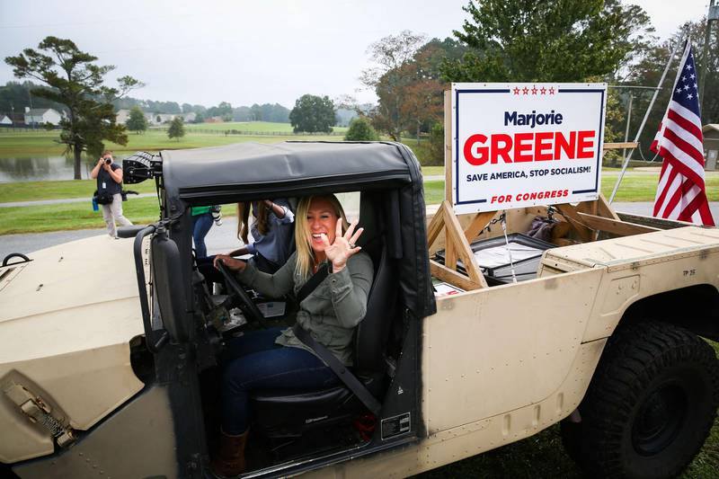 DALLAS, GA - OCTOBER 15: Georgia Republican House candidate Marjorie Taylor Greene and Sen. Kelly Loeffler (R-GA) leave a press conference in a Humvee during which Greene endorsed Loeffler on October 15, 2020 in Dallas, Georgia. Greene has been the subject of some controversy recently due to her support for the right-wing conspiracy group QAnon.   Dustin Chambers/Getty Images/AFP
== FOR NEWSPAPERS, INTERNET, TELCOS & TELEVISION USE ONLY ==
