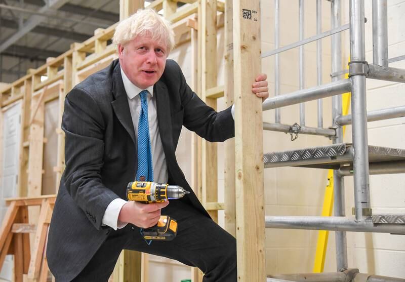 Mr Johnson drills during his visit to Exeter College in September 2020. Getty Images
