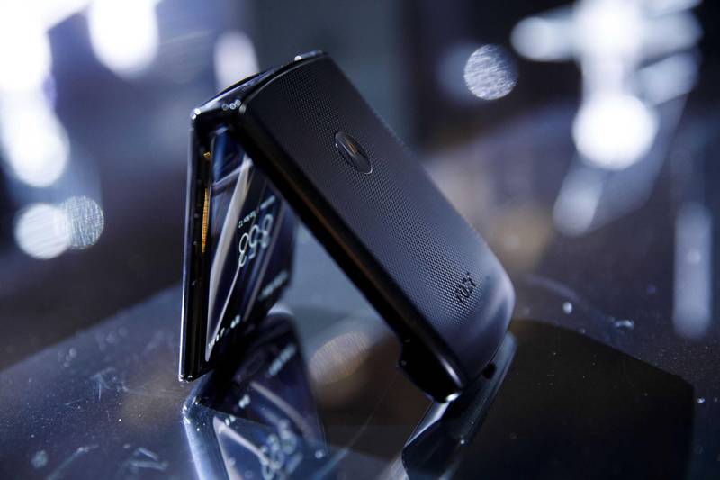 The Lenovo Group Ltd. Motorola Razr smartphone is displayed during an event in Los Angeles, California, U.S., on Tuesday, Nov. 13, 2019. Motorola is bringing back the Razr flip phone 15 years after it first debuted, rebooting it as a foldable smartphone as part of a return to the premium segment that would once again pit the company against Apple and Samsung. Photographer: Patrick T. Fallon/Bloomberg