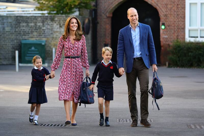 Catherine accompanies Princess Charlotte as she arrives for her first day of school with her brother Prince George at Thomas's Battersea in London in September 2019. 