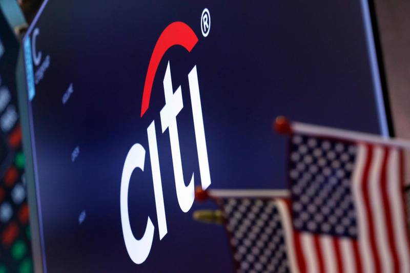 FILE - In this Feb. 8, 2019, file photo the logo for Citigroup appears above a trading post on the floor of the New York Stock Exchange. Citigroup says profit fell 34% in the third quarter due to weakness in its consumer banking division. The New York-based bank said Tuesday, Oct. 13, 2020, that third-quarter net income fell to $3.23 billion from $4.91 billion in the year ago quarter.  (AP Photo/Richard Drew, File)
