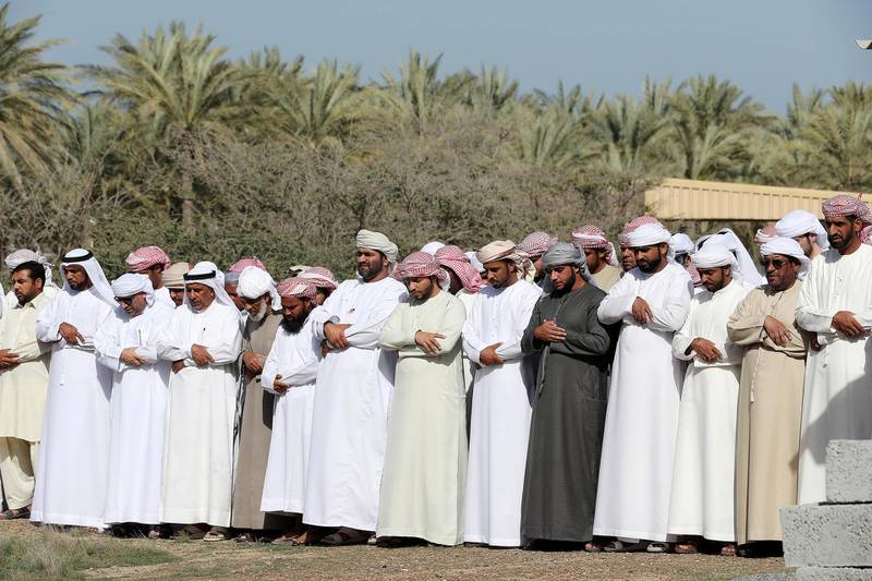 FUJAIRAH , UNITED ARAB EMIRATES , JAN 22 – 2018 :- Relatives and friends during the prayer at the funeral of seven Emirati children four girls and three boys who died of smoke inhalation on Monday morning house fire at Rul Dhadna village in Fujairah.  (Pawan Singh / The National) For News. Story by Ruba Haza