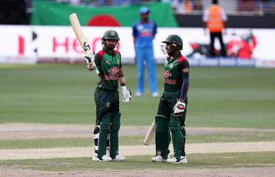 DUBAI , UNITED ARAB EMIRATES, September 28 , 2018 :- Liton Das ( left ) of Bangladesh celebrating after scoring his half century during the final of Unimoni Asia Cup UAE 2018 cricket match between Bangladesh vs India held at Dubai International Cricket Stadium in Dubai. Also seen in the photo on the right side Mehidy Hasan.  ( Pawan Singh / The National )  For News/Sports/Instagram/Big Picture. Story by Paul