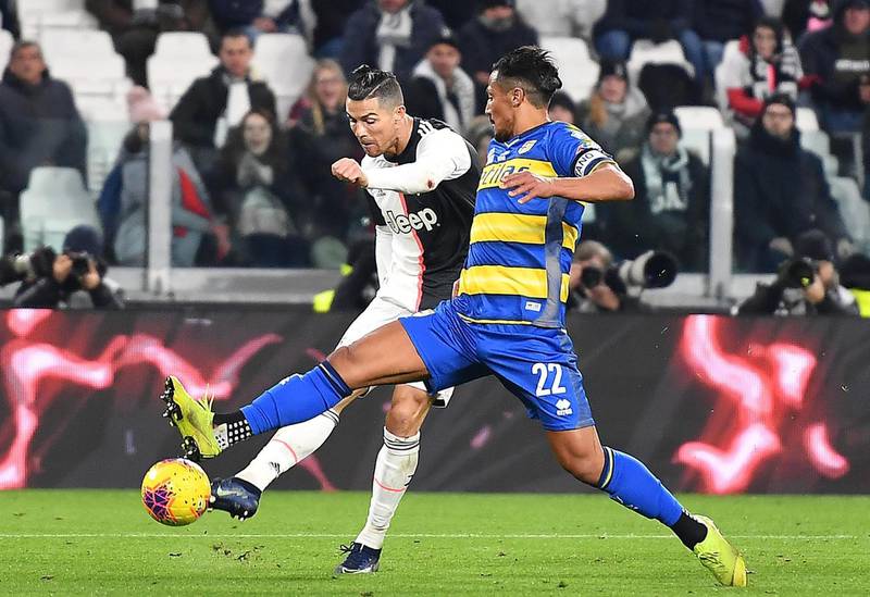 Juventus Cristiano Ronaldo and Parma's Bruno Alves in action. EPA