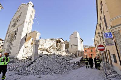 Monks walk in front of the St Benedict Cathedral in Norcia, central Italy on October 31, 2016, a day after the third powerful earthquake to hit Italy in two months destroyed the 14-century building and other historic landmarks. Gregorio Borgia / AP Photo