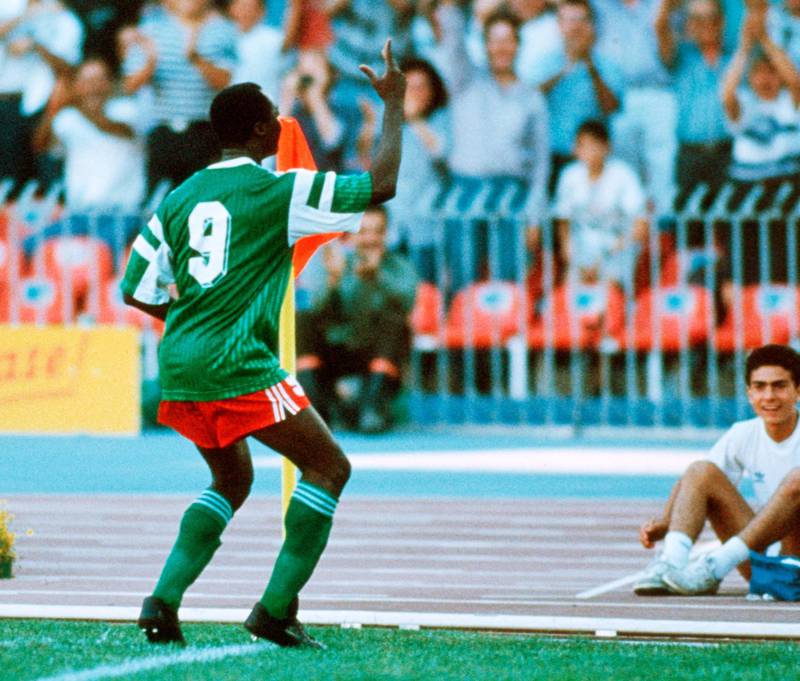 NAPLES, ITALY - JUNE 23: Roger Milla of Cameroon celebrates scoring his first goal during the World Cup eighth final match between Cameroon and Colombia at the San Paolo Stadium on June 23, 1990 in Naples, Italy. (Photo by Henri Szwarc/Bongarts/Getty Images)