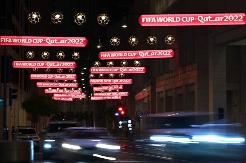 Motorists drive along a street adorned with FIFA World Cup signs in Doha. AFP