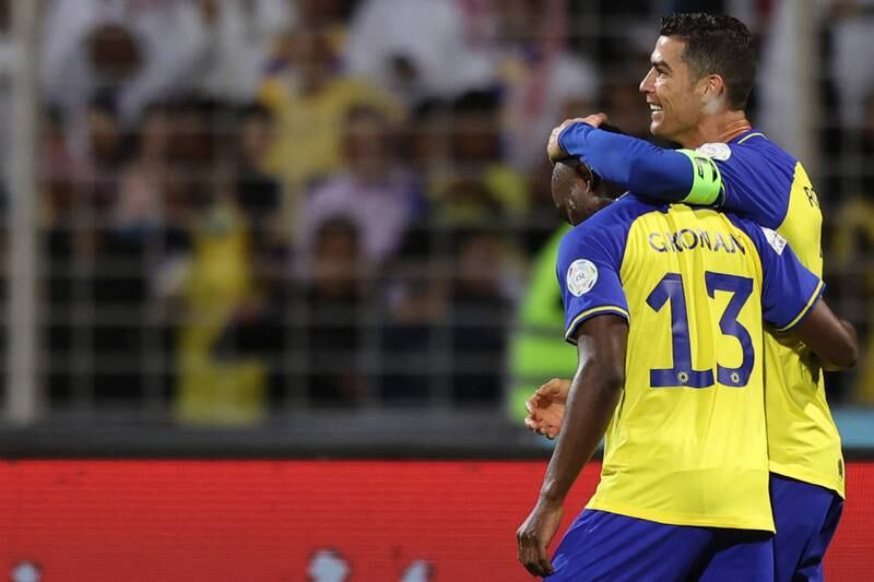 Al Nassr's Portuguese forward Cristiano Ronaldo celebrates with teammates. AFP