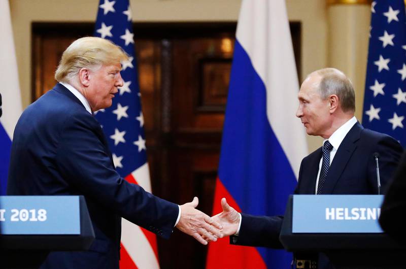 FILE In this file photo taken on Monday, July 16, 2018, U.S. President Donald Trump shakes hand with Russian President Vladimir Putin at the end of the press conference after their meeting at the Presidential Palace in Helsinki, Finland. Pavel Palazhchenko was a constant presence as chief interpreter for Soviet leader Mikhail Gorbachev and Foreign Minister Eduard Shevardnadze, and watched  from Moscow to see how the latest chapter in the US-Soviet story would unfold.  During an interview Monday July 23, 2018, Palazchenko declined to call the latest Helsinki meeting between US President Trump and Russian President Putin an outright failure, but said there seems a lack of clarity on exactly what the two agreed on.  (AP Photo/Alexander Zemlianichenko, File)