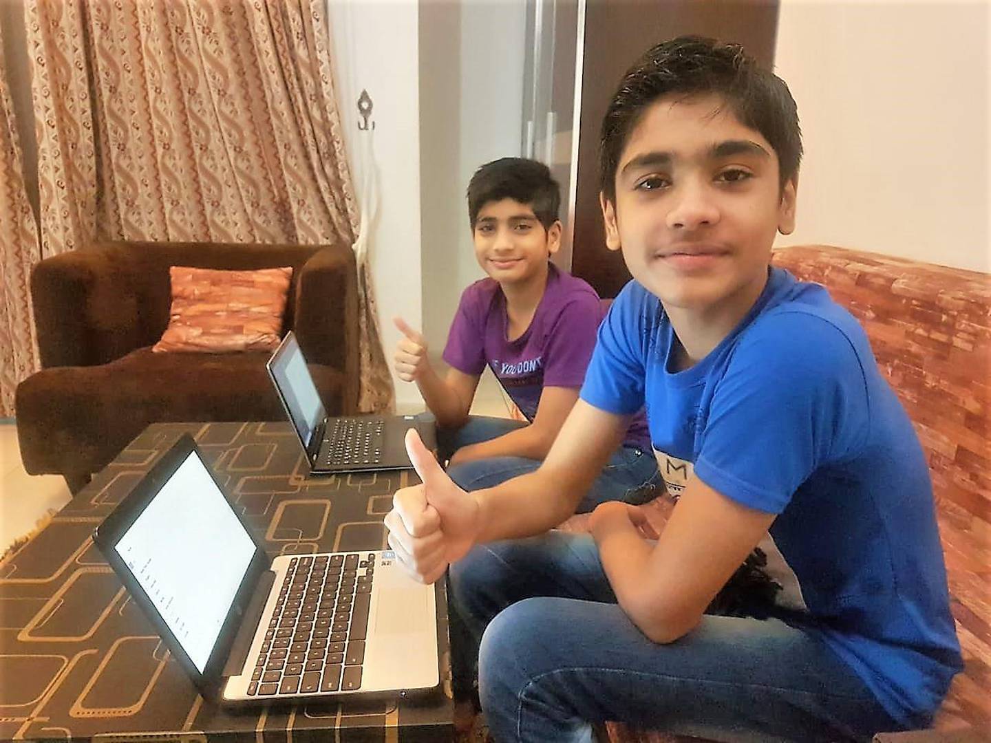 Salaar and Saif bin Sarmad (R-L) attend virtual school after getting free laptops. Courtesy: Arshia Sarmad 