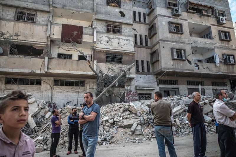 Palestinians inspect the Abu Hatab family's house after an israeli air strike reportedly struck their house in al-Shati Refugee Camp. Getty Images