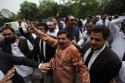 Lawyers gather to protest following the arrest of Pakistan's former Prime Minister Imran Khan, outside his residence in Lahore, Pakistan on Saturday. Reuters