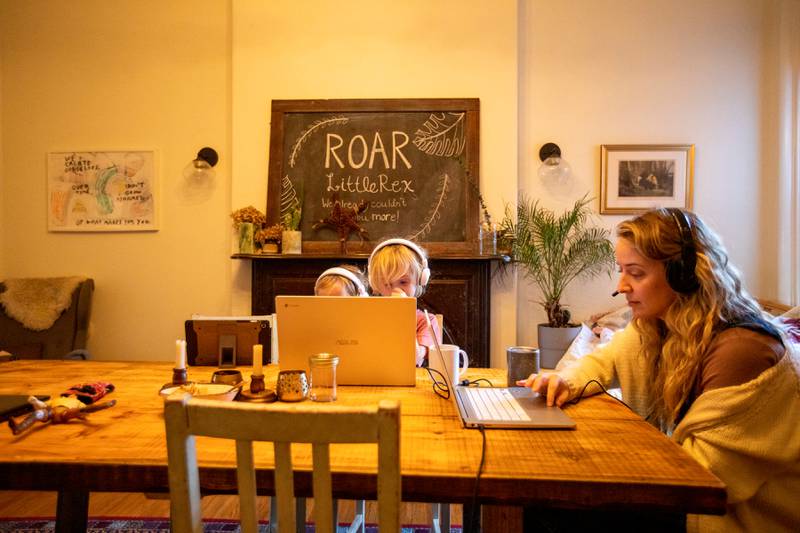 Bethany Stief works from home while twin six-year-old girls Nora and Willa attend online school amid surging Covid-19 cases, in Hamilton, Ontario, Canada, on January 7. Reuters