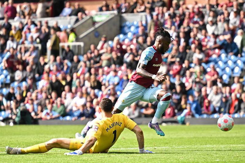 Burnley's Maxwel Cornet rounds Villa goalkeeper Emiliano Martinez and scores a consolation goal for the Clarets. AFP