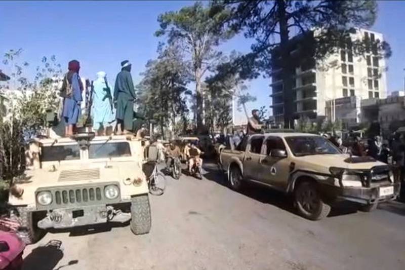 A Taliban convoy enters Herat. The group has also taken Lashkar Gah, capital of southern province Helmand.