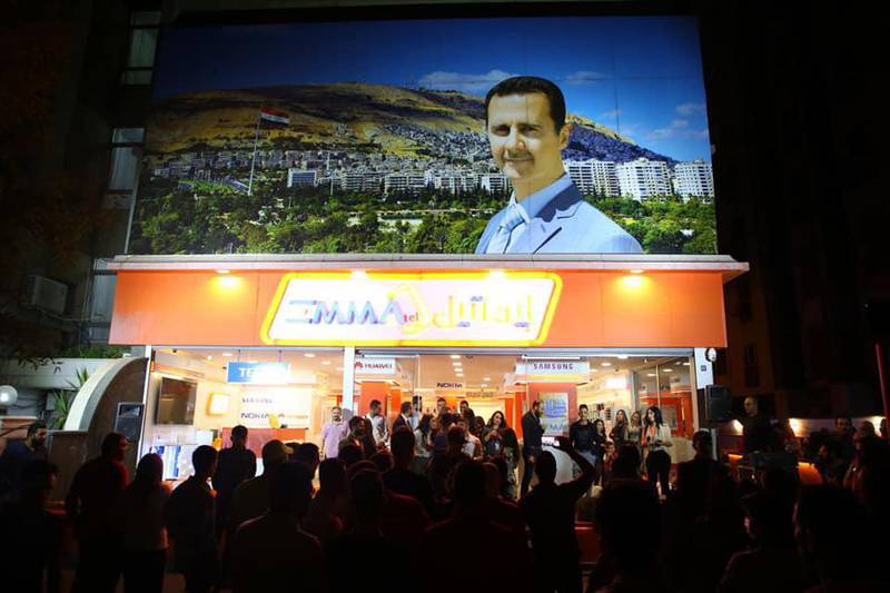 Shoppers crowded outside an Emmatel store in an upmarket district of Damascus. Courtesy Emmatel