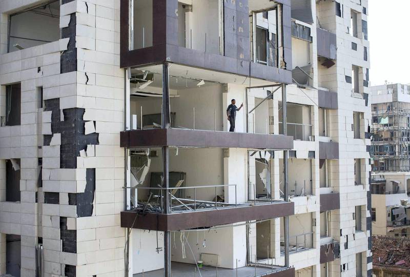 LEBANON, Beirut: 15 August 2020 
A resident looks out from his apartment damaged from the blast which occurred in the port of Beirut after 2,700 tonnes of ammonium nitrate were ignited from a fire, causing more than 200 deaths and thousands of severely injured. 