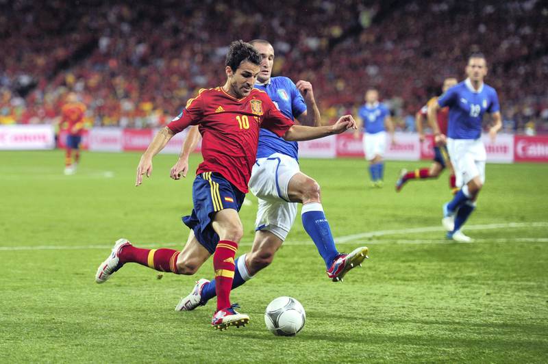 KIEV, UKRAINE - JULY 01:  Cesc Fabregas of Spain battles for the ball with Giorgio Chiellini of Italy during the UEFA EURO 2012 final match between Spain and Italy at the Olympic Stadium on July 1, 2012 in Kiev, Ukraine.  (Photo by Shaun Botterill/Getty Images)