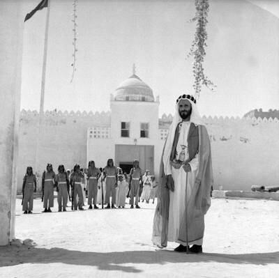 Sheikh Shakhbut Bin Sultan Al Nahyan standing in front of Qasr Al Hosn. ©National Archives.