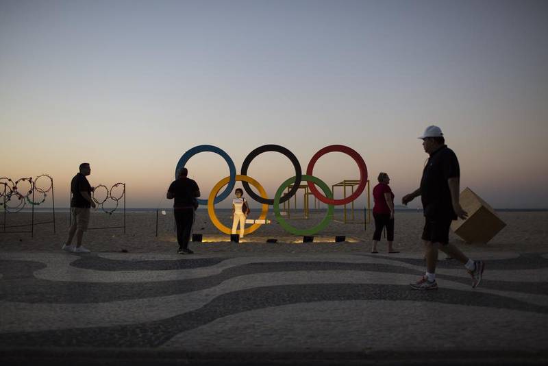 Olympic fever grips the host city Rio de Janeiro with only a week to go before the opening ceremony next Friday in Brazil. The iconic Copacabana beach will be the starting point for the road cycling race, marathon swimming and triathlon competitions. Felipe Dana / AP Photo