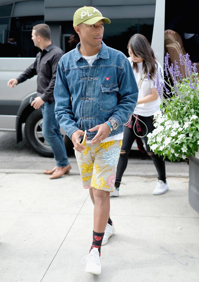 Wearing a denim jacket with colourful printed shorts to the G-Star Raw Presents The New G-Star Elwood X25 Prints show, during New York Fashion Week spring/summer 2018. AFP