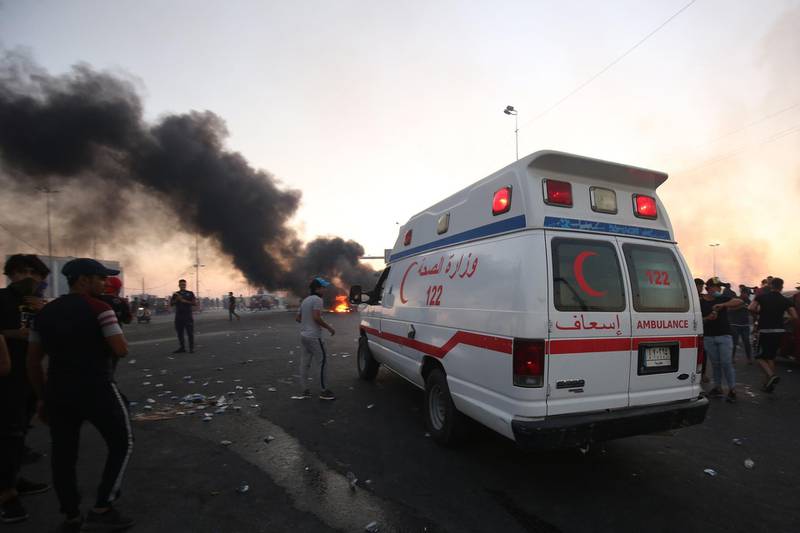 An ambulance arrives at a demonstration in Baghdad. AFP