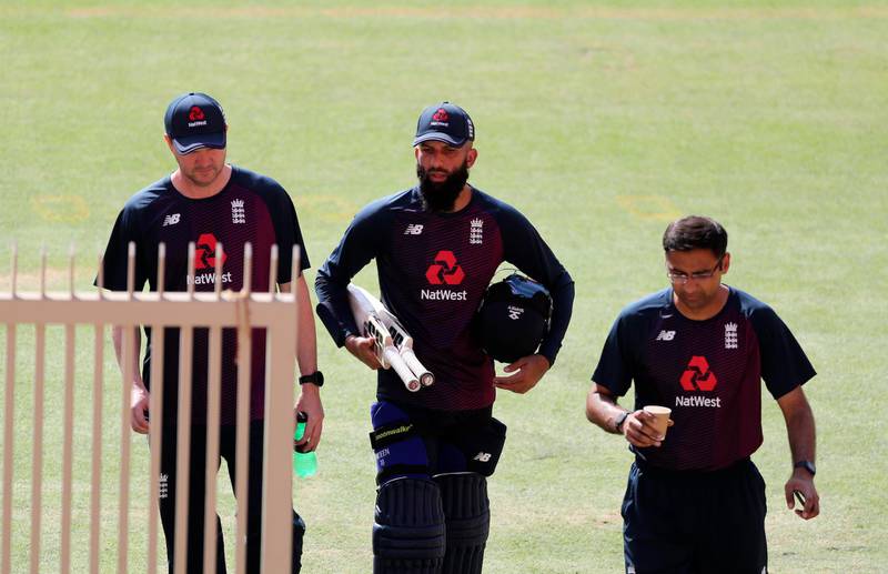 England's Moeen Ali, center, arrives at training. AP