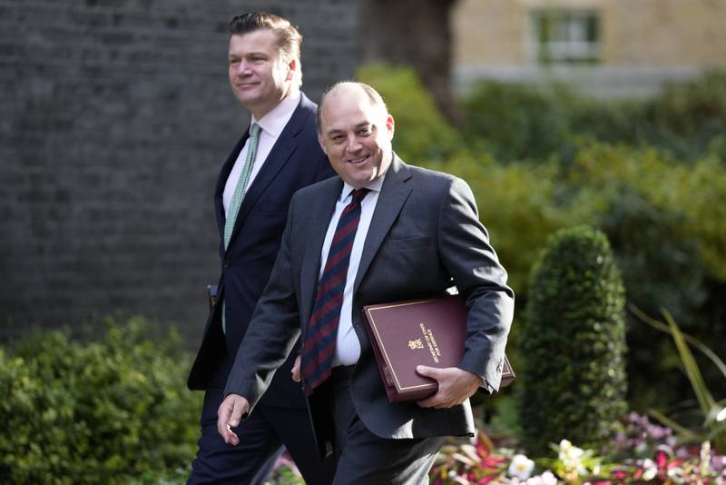 Defence Secretary Ben Wallace, front, arrives for the new Cabinet meeting. AP