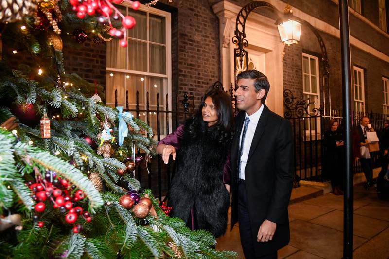 Rishi Sunak, pictured with his wife is Akshata Murty, is hoping political silence over Christmas will quieten worker unrest. Getty Images
