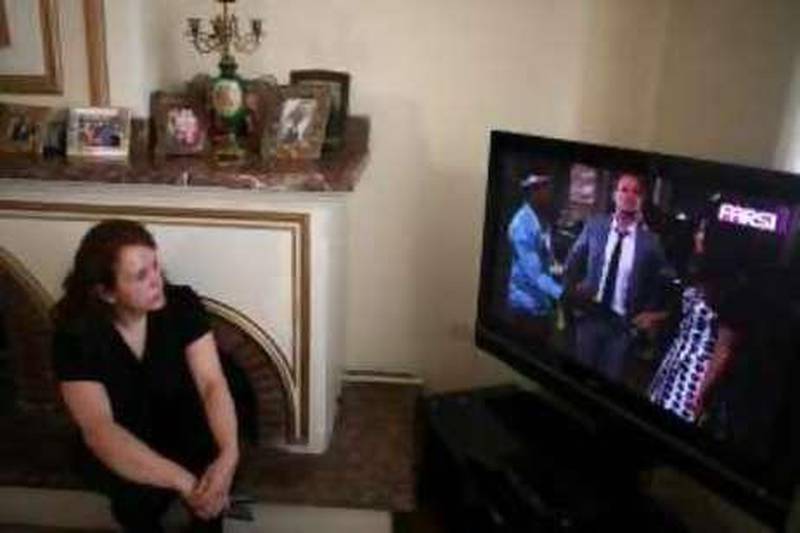 Jila Faiz 52 watching Persian speaking channel Farsi 1 base in Dubai Newsha Tavakolian for The National