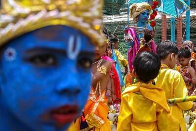 Indian school children, some with their faces painted in blue, and dressed as the Hindu god Lord Krishna take part in the Janmashtami festival celebrations at the Shivaji Shikshan Sanstha - multipurpose technical high school, in Mumbai, India, 05 September 2023.  Janmashtami is an annual Hindu festival celebrating the birth anniversary of Lord Krishna.   EPA / DIVYAKANT SOLANKI