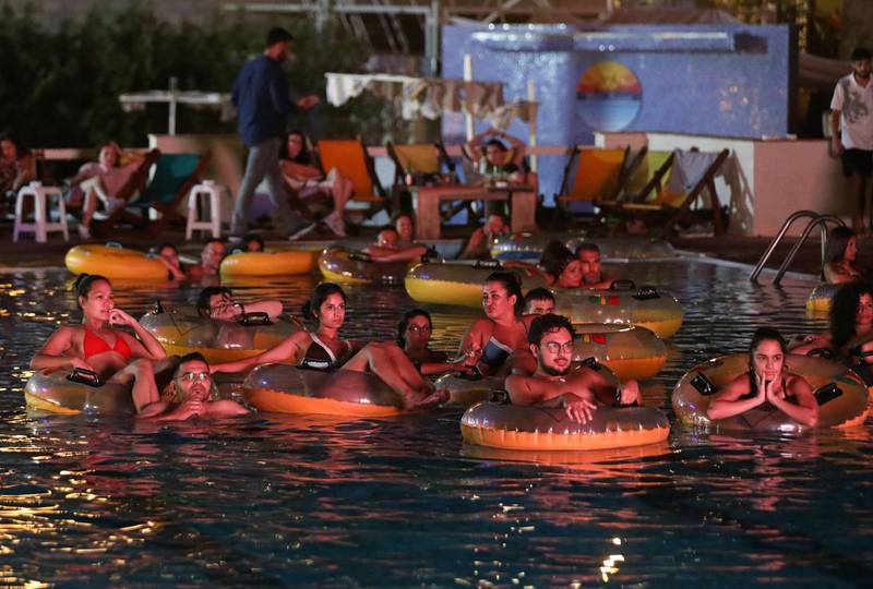People watch a film while in a swimming pool in Jounieh, Lebanon. Reuters
