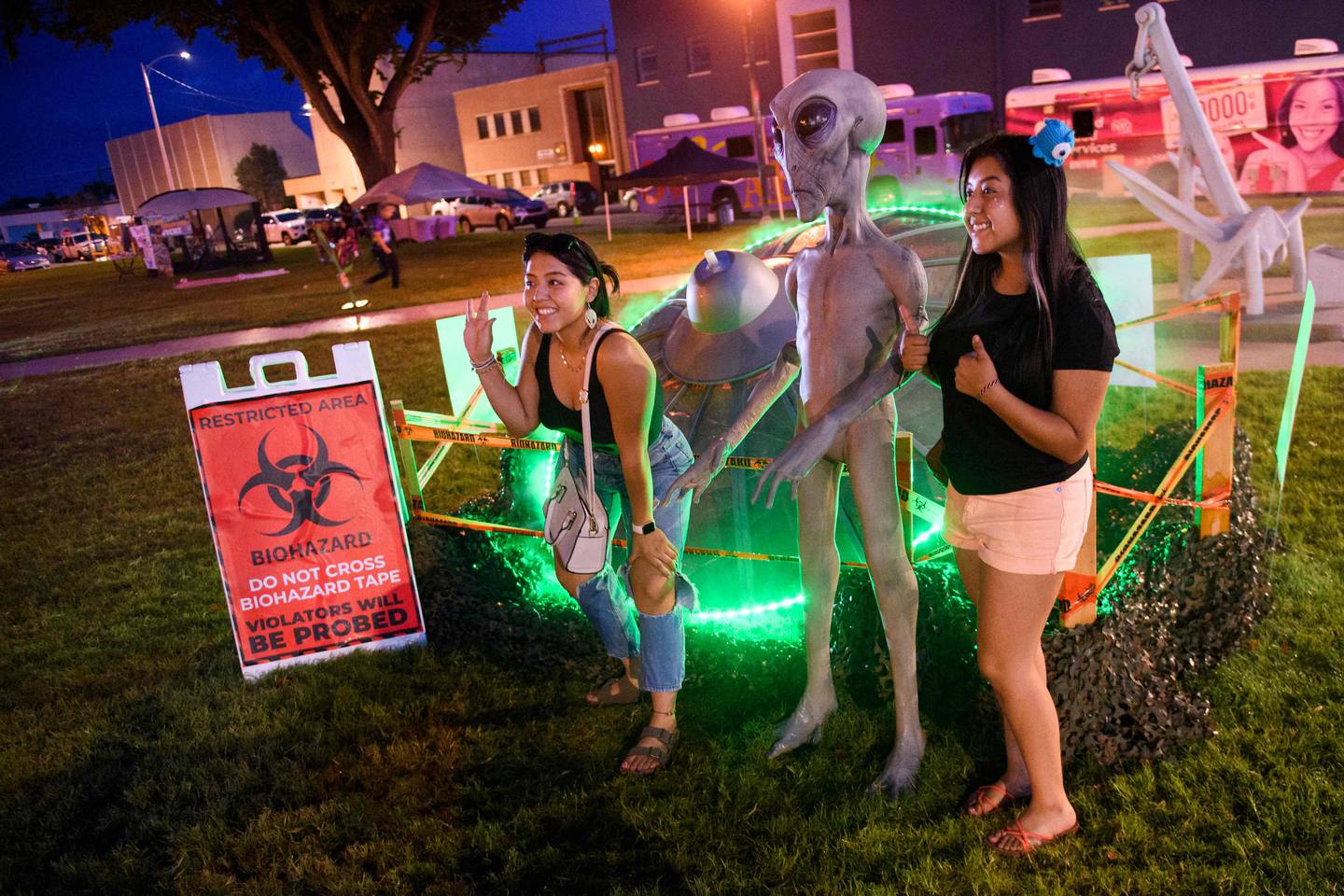 Alien fans pose for pictures during the UFO Festival in Roswell, New Mexico. AFP