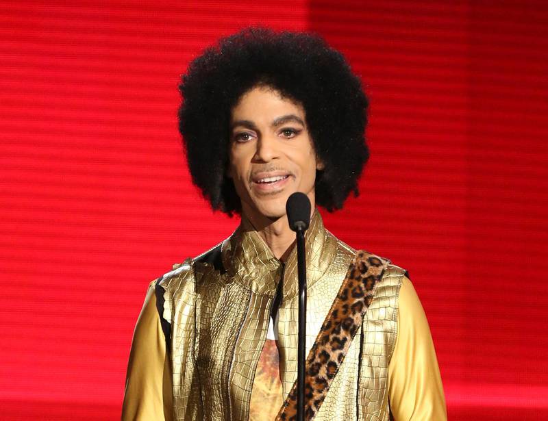 FILE - In this Nov. 22, 2015, file photo, Prince presents the award for favorite album - Soul/R&B at the American Music Awards in Los Angeles. The memoir Prince was working on at the time of his death, "The Beautiful Ones," is due out in late October 2019. (Photo by Matt Sayles/Invision/AP, File)
